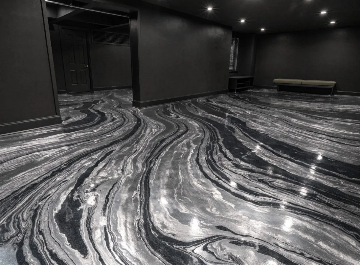 Silver and charcoal metallic epoxy floor in a basement rec room